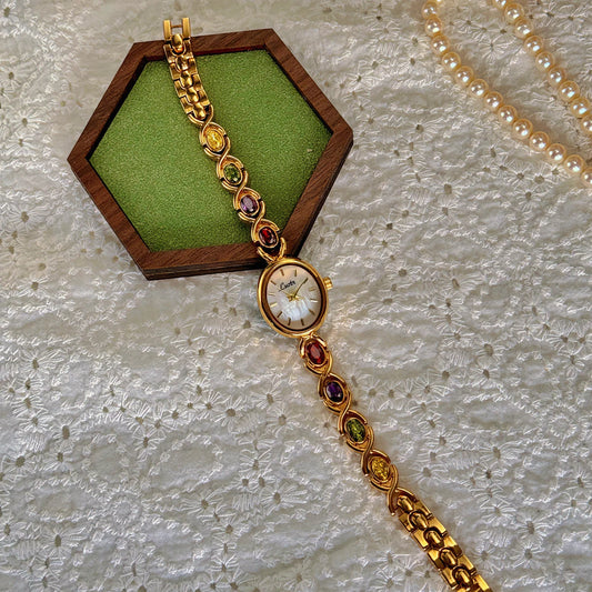 1Pc New High-End Luxury Women'S Watch Embedded with Colorful Tourmalines, Diamonds and an Oval Shaped Mother of Pearl Dial.